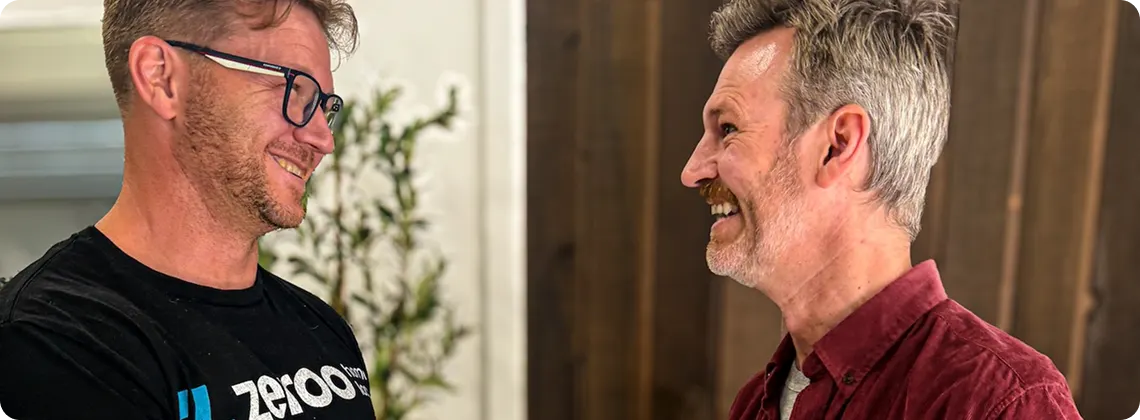 Two members of the Zeroo team talking